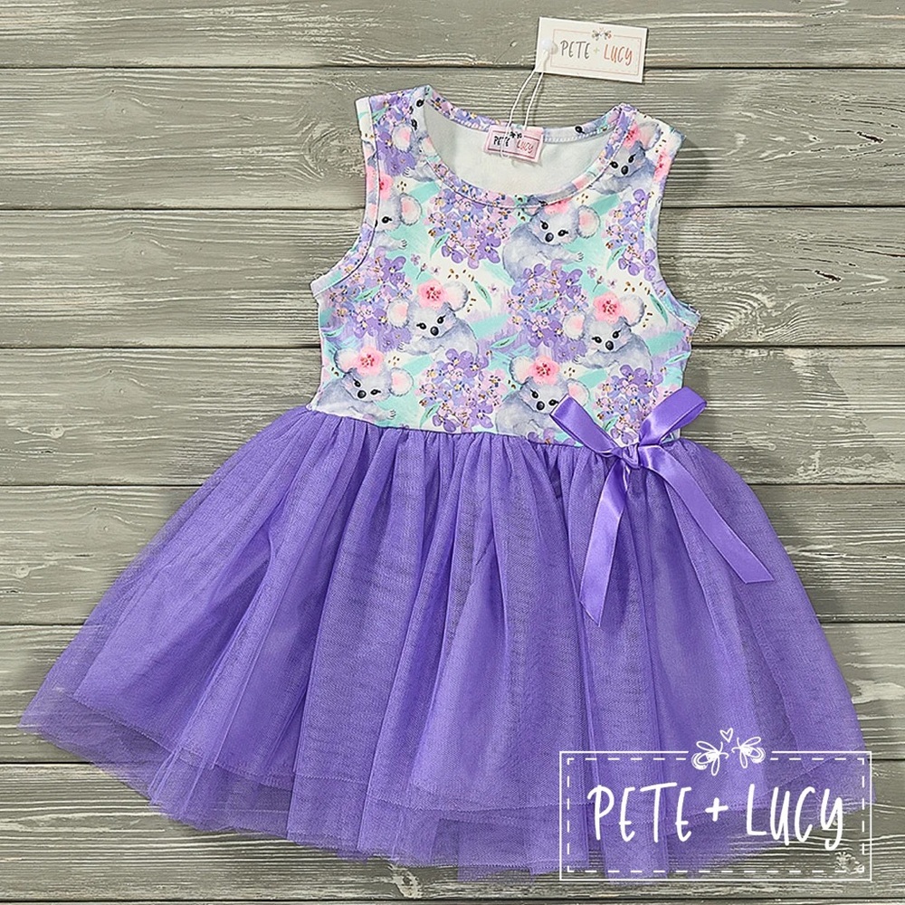 This girls' sleeveless purple blooming koalas tulle dress is bright and vibrant